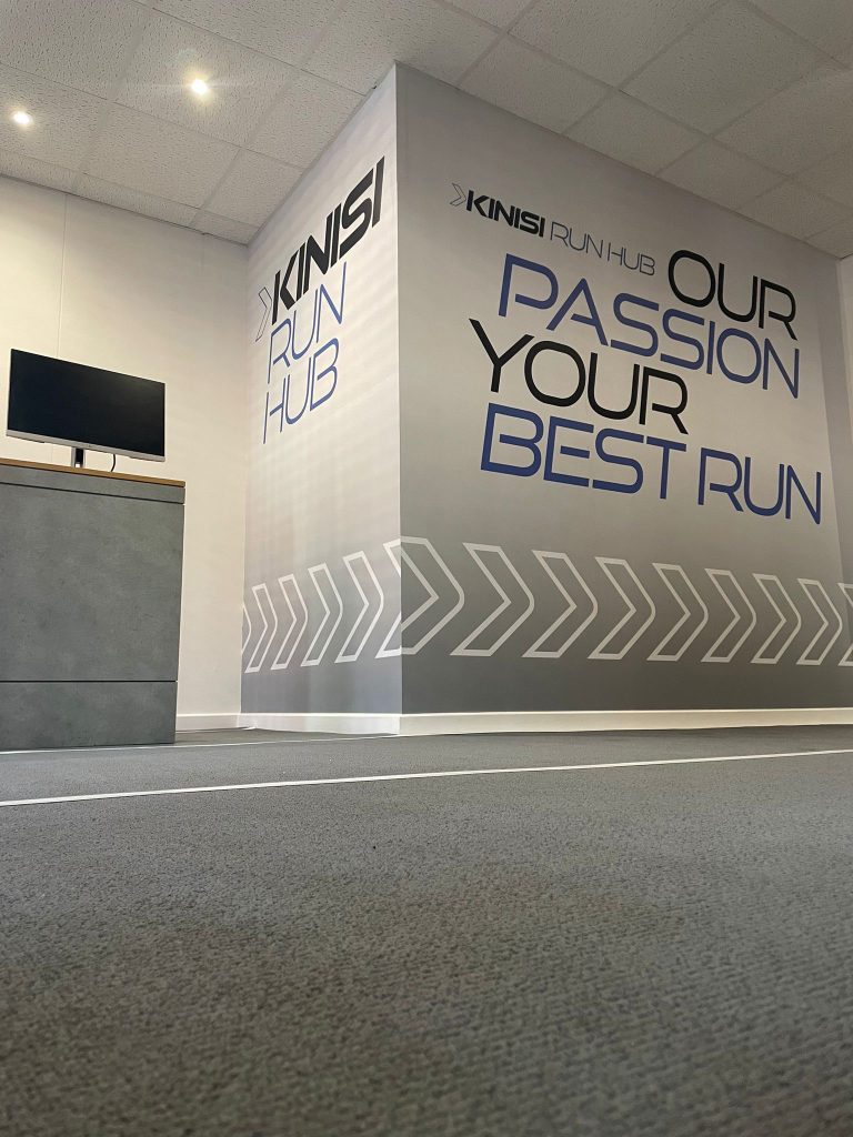 In-store running track and pressure plates for gait analysis